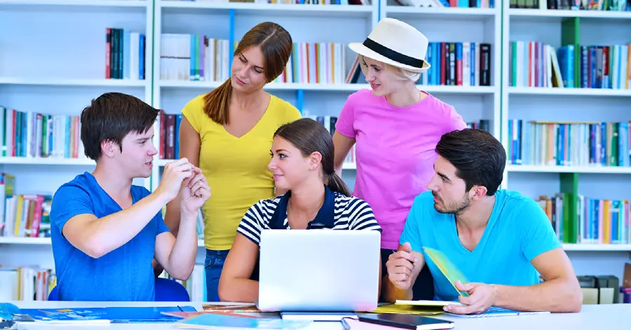 A group of young people learning together and discussing the subject matter.