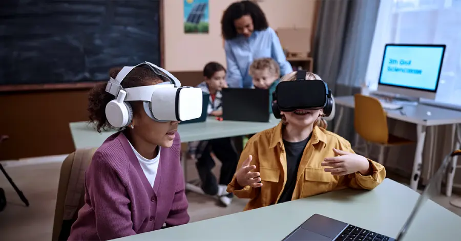 Two students are learning through their VR headsets. 