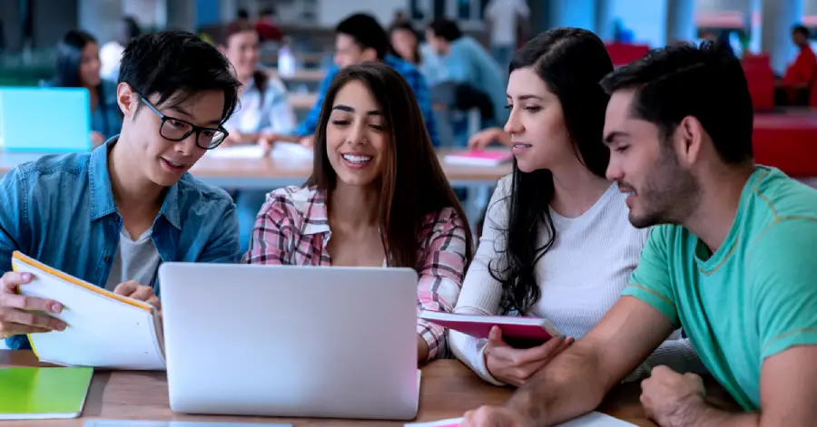  A diverse group of college learners doing peer-to-peer learning and studying about the future trends in learning platform development.