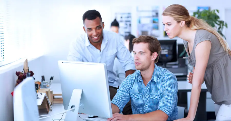 A multi-ethnic group of instructional designers evaluating the best practices for custom e-learning content development. 