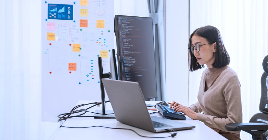 A female developer working on her laptop